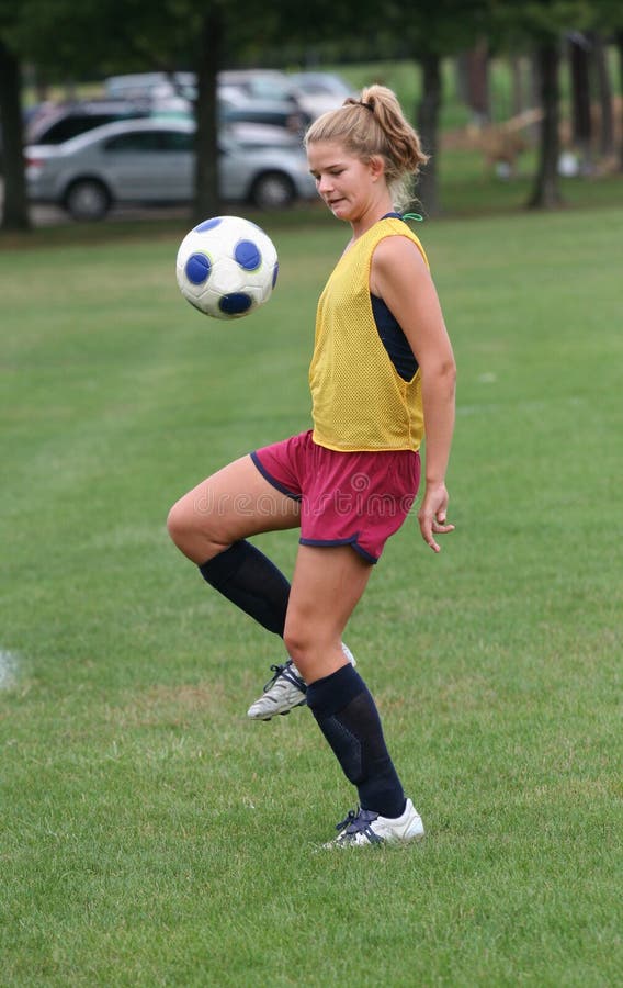 Youth Teen Boucing Soccer Ball in Air