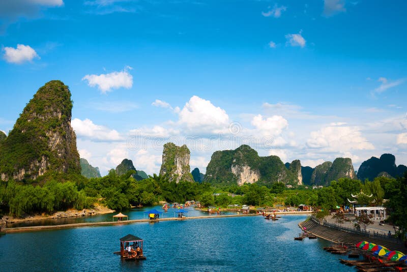 Yulong River landscape in yangshuo guilin China. Visitors Drifting and Enjoy the scenery in a boat. Yulong River landscape in yangshuo guilin China. Visitors Drifting and Enjoy the scenery in a boat.