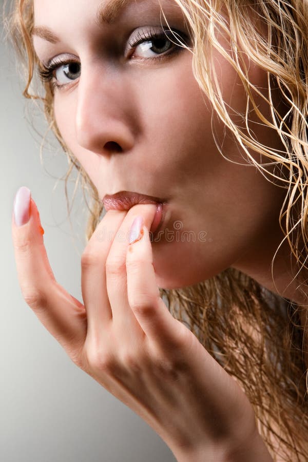 Women erotically licking their fingers