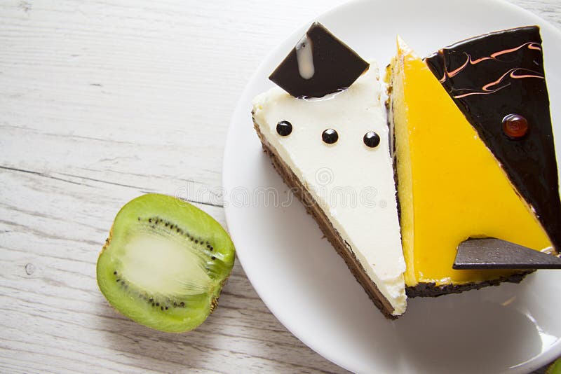 Yummy cheesecakes on wooden background. Three various pieces of cheesecakes on plate, closeup studio photo royalty free stock image Yummy cheesecakes on wooden background. Three various pieces of cheesecakes on plate, closeup studio photo royalty free stock image