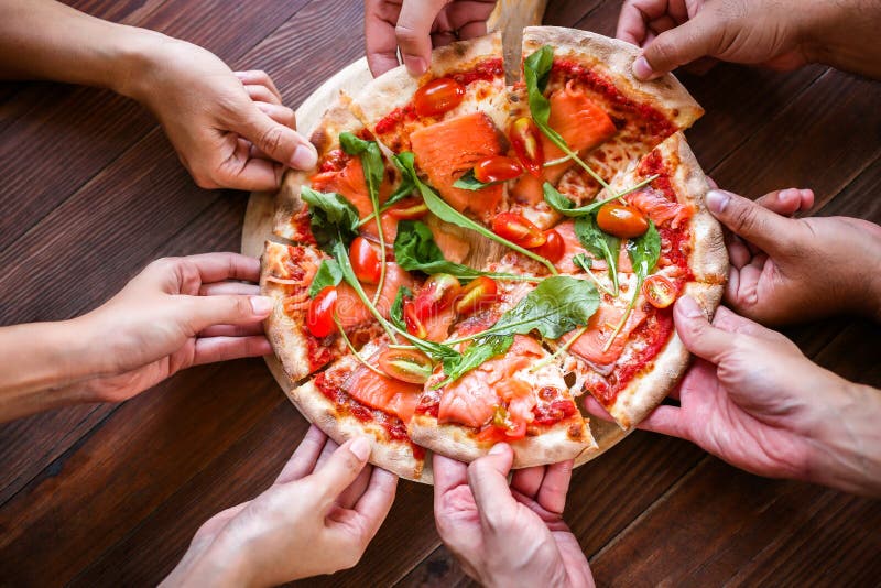 The customers or friend are taking it for eating delicious pizza. royalty free stock image The customers or friend are taking it for eating delicious pizza. royalty free stock image