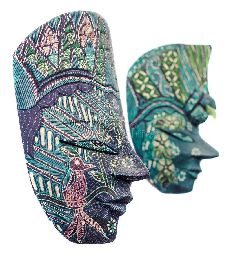 Vivid colored african masks, male and female, halloween mask, close up, isolated. Vivid colored african masks, male and female, halloween mask, close up, isolated