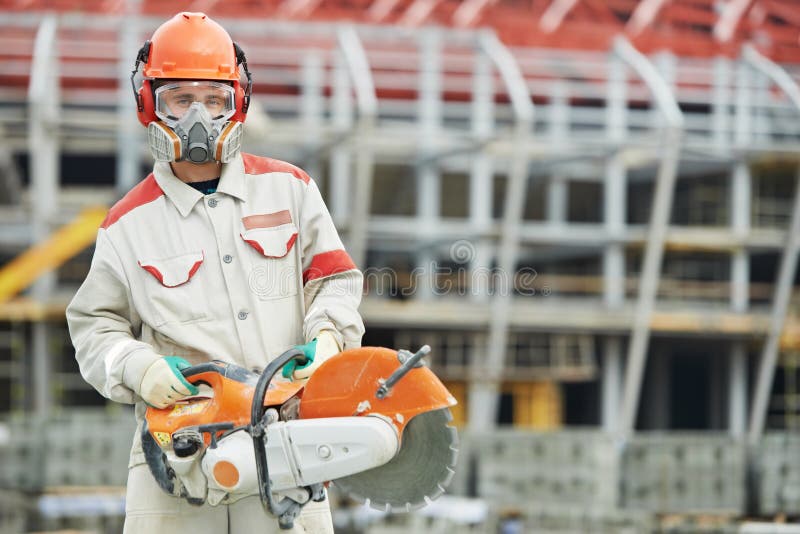 Construction worker in safety protective equipment with petrol disc cutter. Construction worker in safety protective equipment with petrol disc cutter