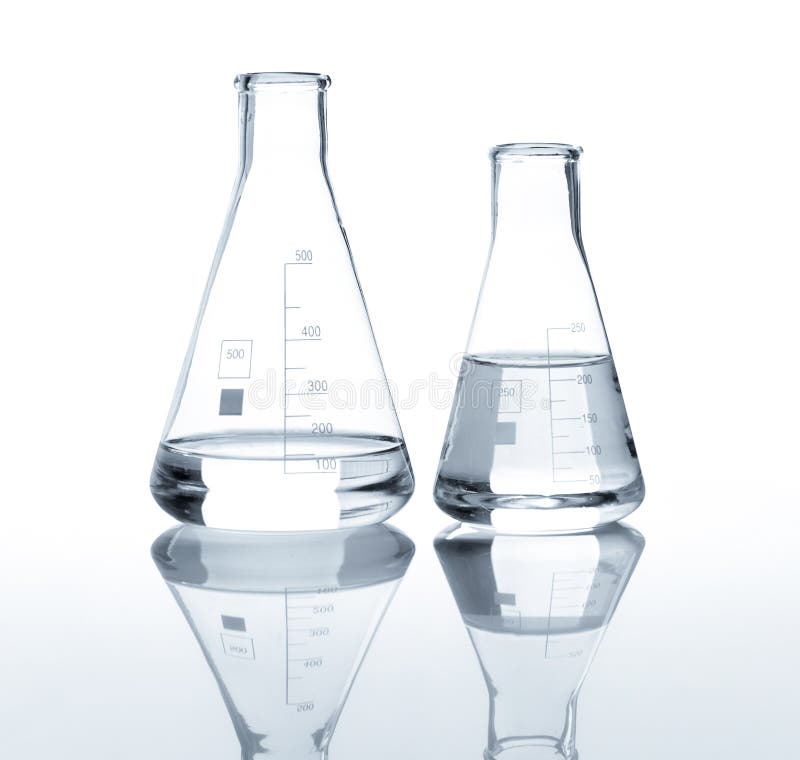 Two laboratory flasks with a clear liquid, isolated. Two laboratory flasks with a clear liquid, isolated