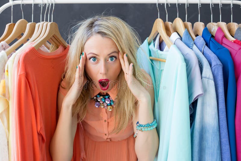 Stressed out woman deciding what to wear. Stressed out woman deciding what to wear