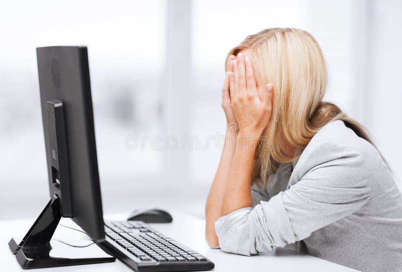 Business, office, school and education concept - stressed businesswoman with computer at work. Business, office, school and education concept - stressed businesswoman with computer at work