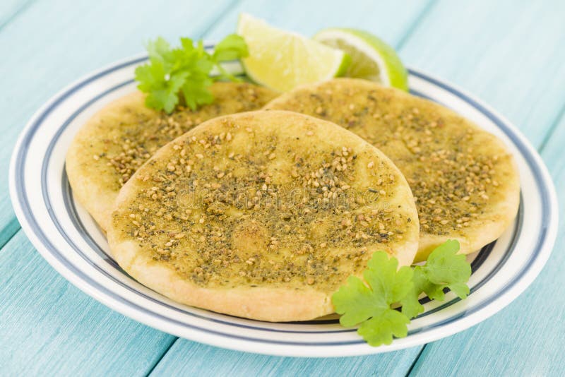 Zaatar Manakish - Flatbread topped with zaatar and olive oil. Traditional Arab food.