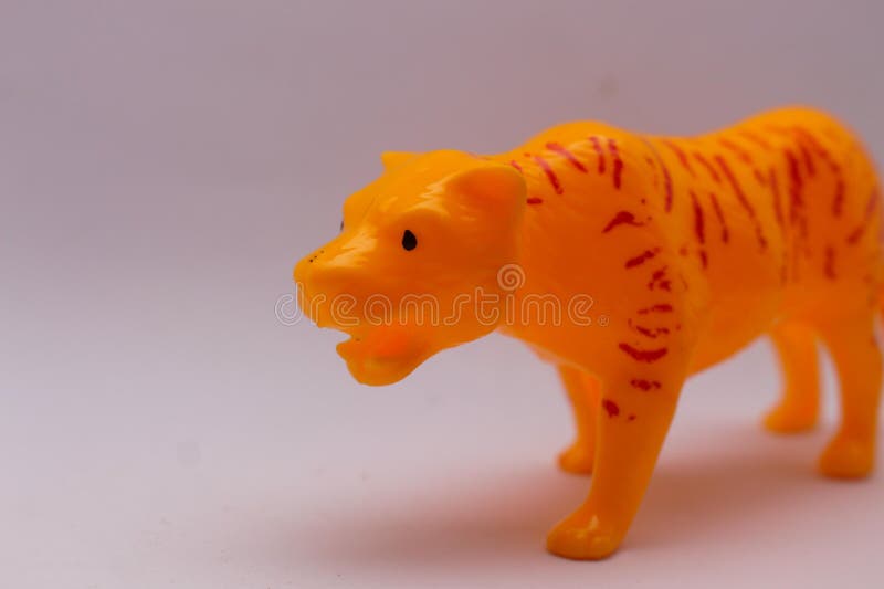 Toddler toy in the shape of a tiger on a white background. Toddler toy in the shape of a tiger on a white background