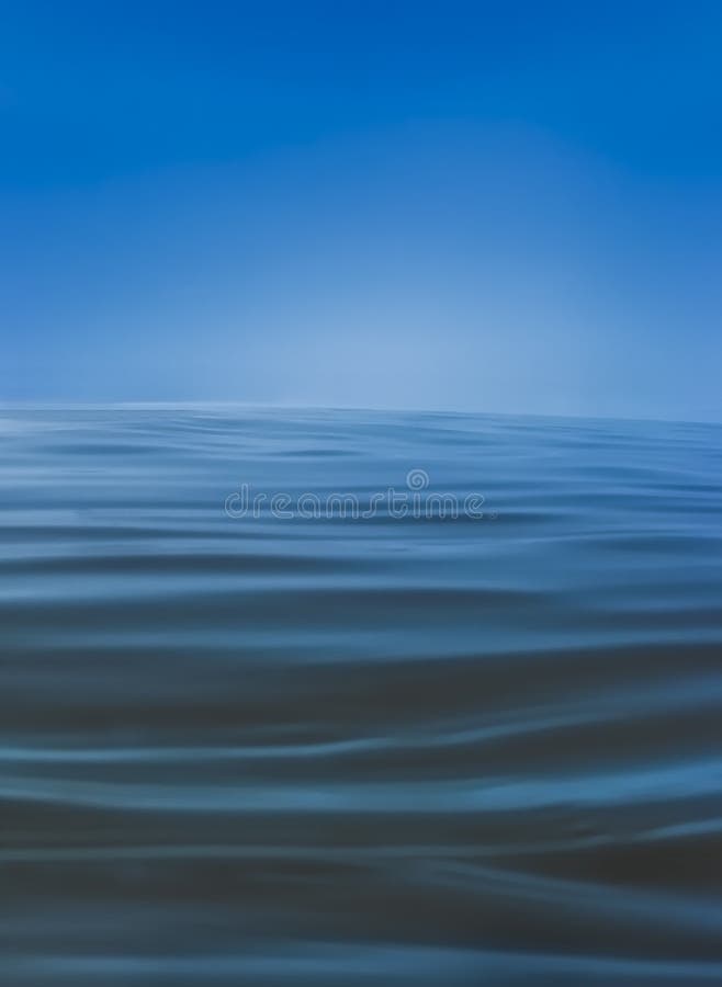 Soft blue waves on ocean water surface, soft texture with infinite horizon and blue sky. Soft blue waves on ocean water surface, soft texture with infinite horizon and blue sky