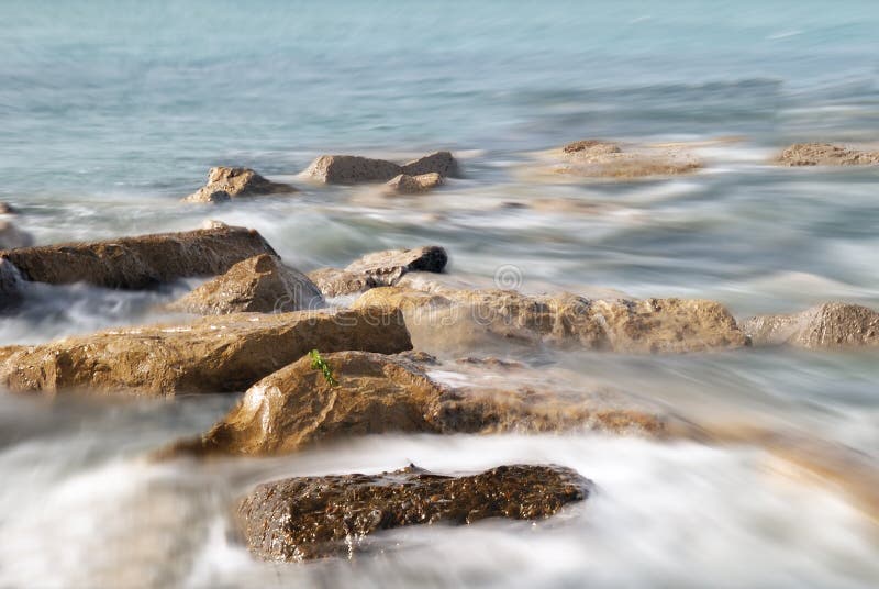 Soft waves hit the rocks. Soft waves hit the rocks