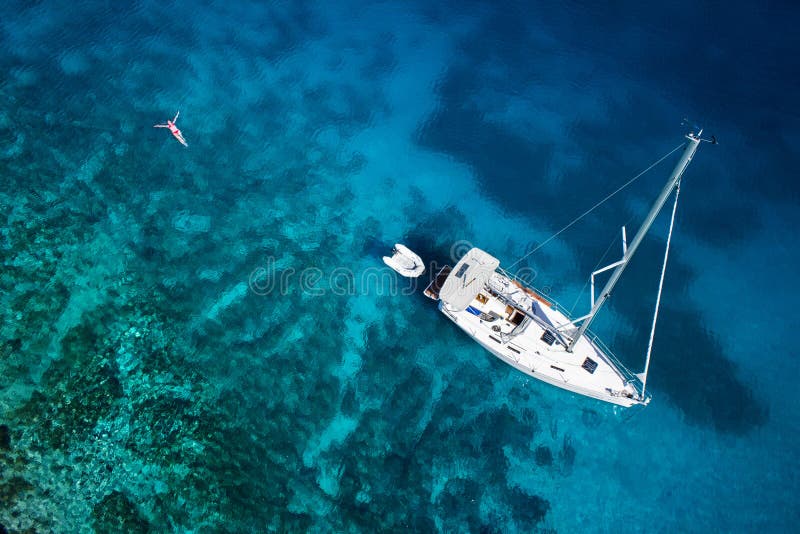 Amazing view to yacht, swimming woman and clear water caribbean paradise. Amazing view to yacht, swimming woman and clear water caribbean paradise.