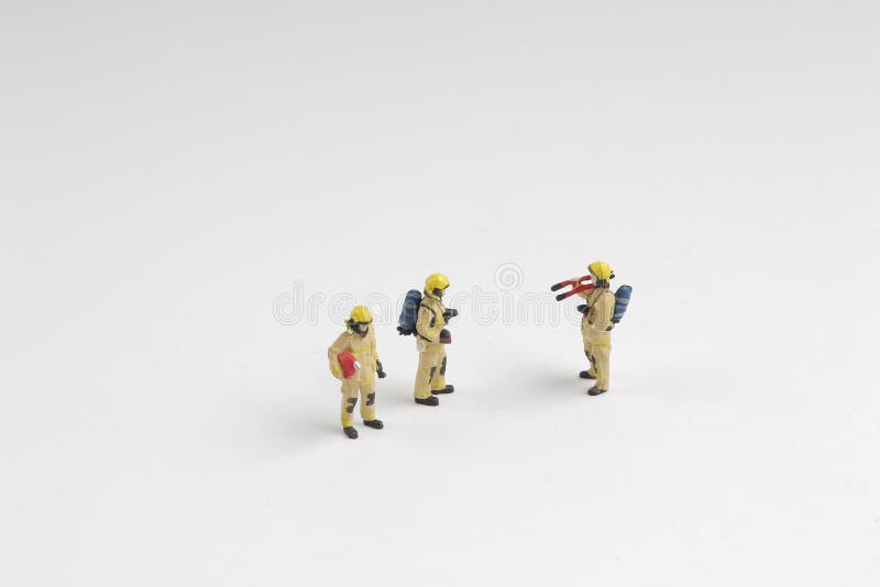 Zahl eines Feuerwehrmannes in der Uniform Berufsleute lizenzfreies stockfoto Zahl eines Feuerwehrmannes in der Uniform Berufsleute lizenzfreies stockfoto