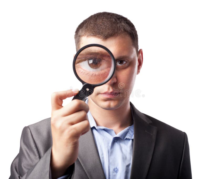 Zakenman die door een vergrootglas kijkt stock foto Zakenman die door een vergrootglas kijkt stock foto
