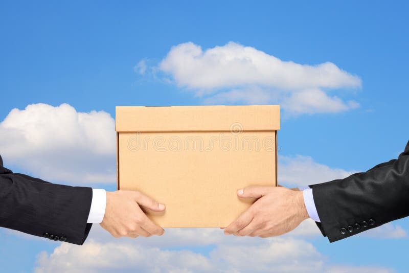 A businessman delivering a package to a man isolated on blue sky with clouds. A businessman delivering a package to a man isolated on blue sky with clouds