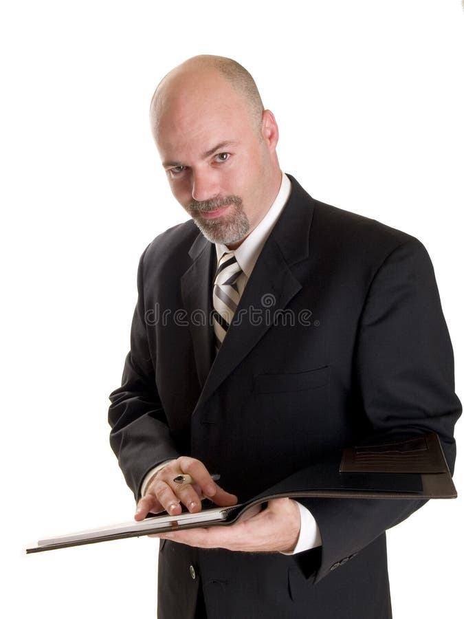 Stock photo of a well dressed businessman taking notes in a notebook, isolated on white. Stock photo of a well dressed businessman taking notes in a notebook, isolated on white.