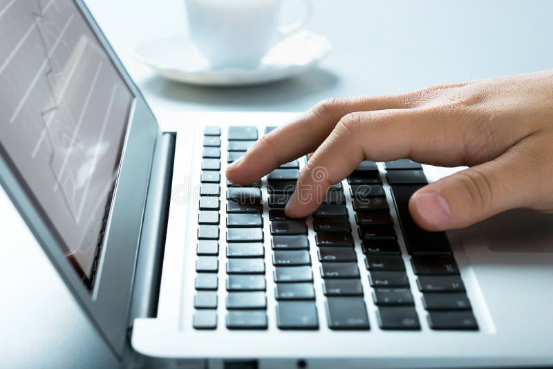 Closeup of businessman typing on laptop computer. Closeup of businessman typing on laptop computer