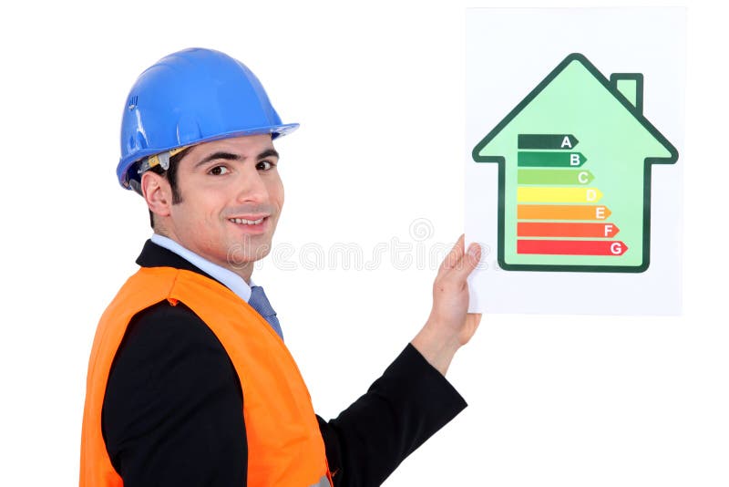 Businessman holding an energy consumption label. Businessman holding an energy consumption label