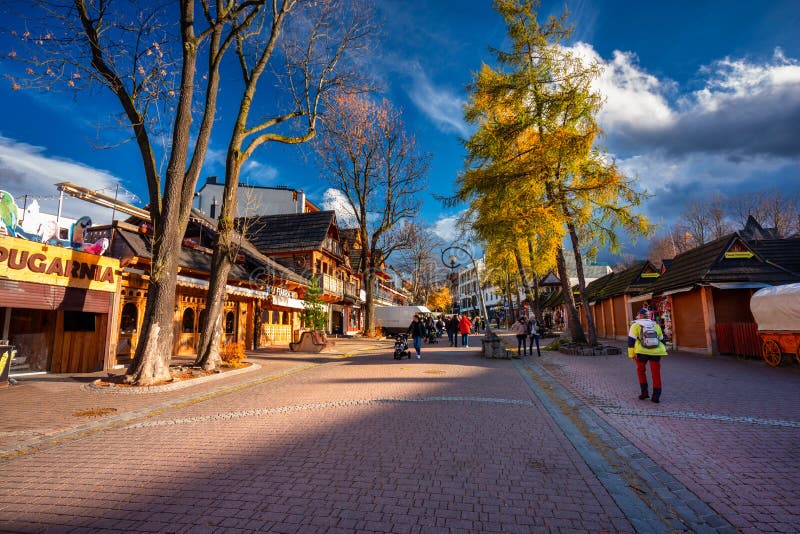 Zakopane, Poland - November 4, 2021: People on the main Krupowki street in Zakopane at autumn. Krupowki street is the main