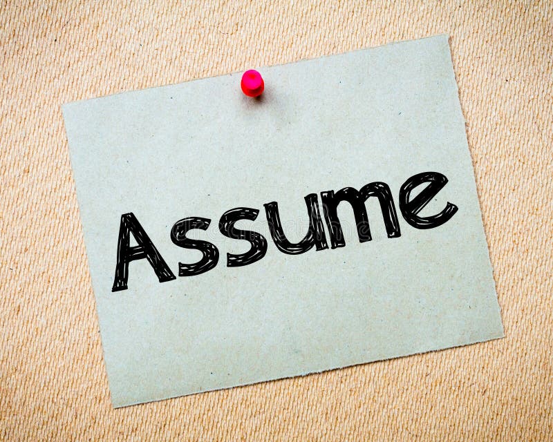 Assume Message. Recycled paper note pinned on cork board. Concept Image. Assume Message. Recycled paper note pinned on cork board. Concept Image