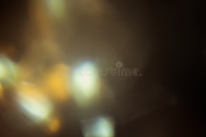 Blurred defocused light. lens flare. shiny spots. dark background. Blurred defocused light. lens flare. shiny spots. dark background