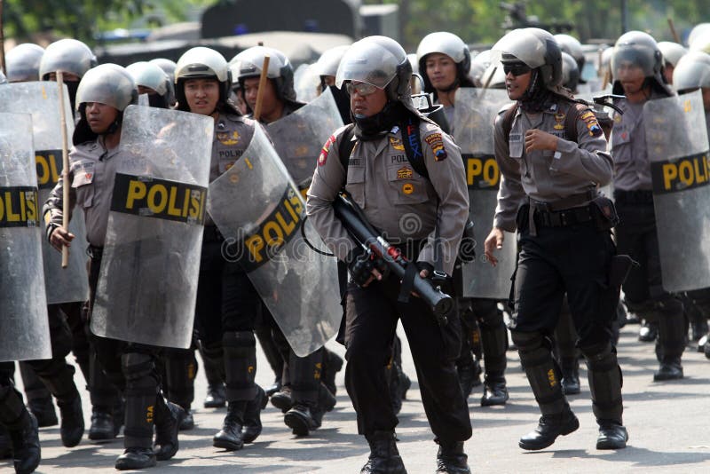 Riot police preparing to secure the parliament building during a rally in the city of Solo, Central Java, Indonesia. Riot police preparing to secure the parliament building during a rally in the city of Solo, Central Java, Indonesia