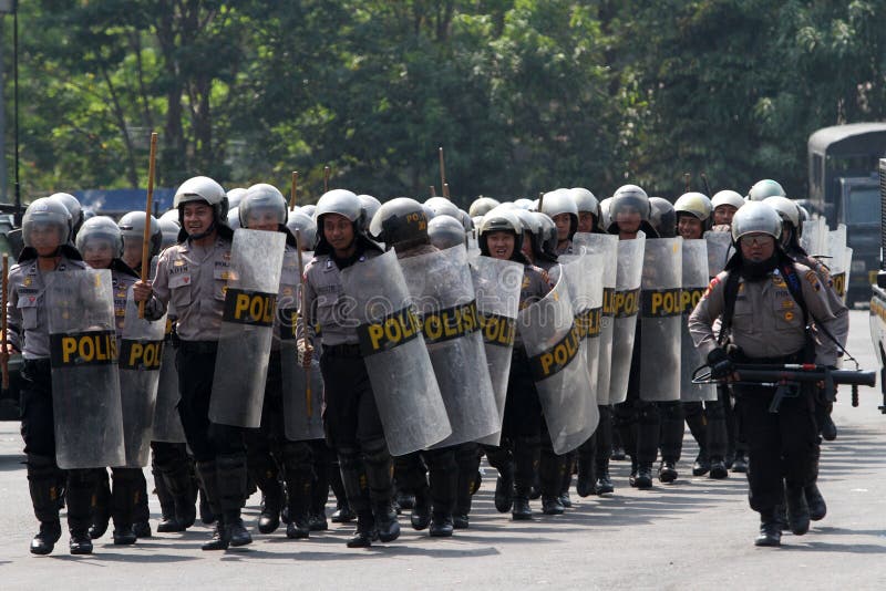 Riot police preparing to secure the parliament building during a rally in the city of Solo, Central Java, Indonesia. Riot police preparing to secure the parliament building during a rally in the city of Solo, Central Java, Indonesia