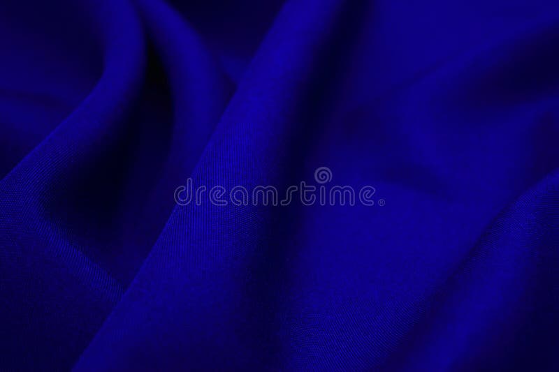 Blue fabric closeup. Plexus threads. Clothing industry. Abstract background. Textile waves. Blue fabric closeup. Plexus threads. Clothing industry. Abstract background. Textile waves.