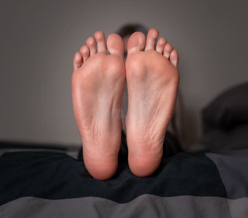 A closeup of the soles of female feet. A closeup of the soles of female feet