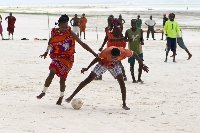 Zanzibar Tanzania 14/08/2010:   Masai playing soccer with tourists. Zanzibar Tanzania 14/08/2010:   Masai playing soccer with tourists