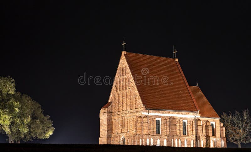 Zapyskis, Lithuania November 04 2020: early Gothic red brick church built between 1530 and 1578 In Lithuania, Zapyskis at night