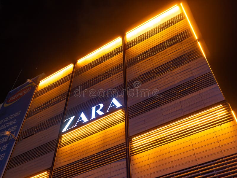 Zara store beautifully illuminated at night, in Bucharest