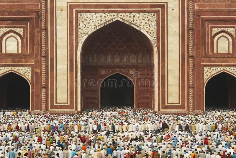 Thousands of people gather in front of the mosque at the Taj Mahal to celebrate the Muslim festival of Eid ul-Fitr in Agra, Uttar Pradesh, India. Thousands of people gather in front of the mosque at the Taj Mahal to celebrate the Muslim festival of Eid ul-Fitr in Agra, Uttar Pradesh, India