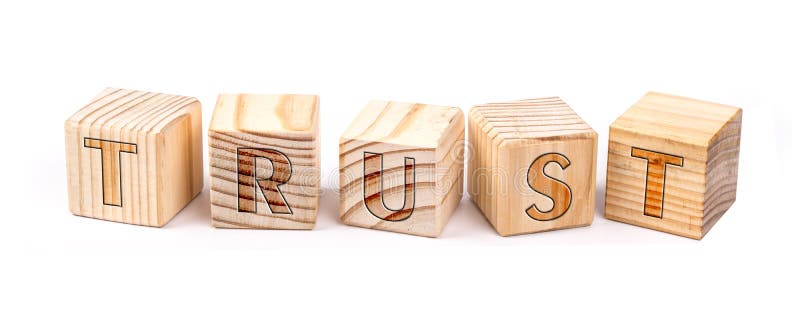 Trust written on wooden blocks isolated on white background. Trust written on wooden blocks isolated on white background