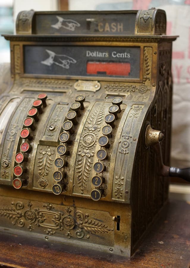 This antique cash register is made of brass and was cranked to operate. This antique cash register is made of brass and was cranked to operate.