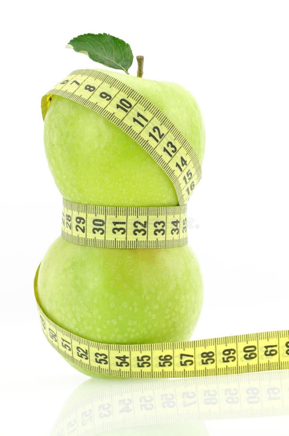 Green apples with measuring tape. Green apples with measuring tape