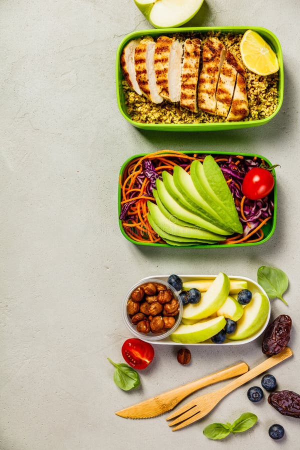 Healthy meal prep containers: Couscous with grilled chicken breast, salad, avocado, berry, apple, nuts and dry dates. Keto, ketogenic diet, low carb, healthy food concept. Top view. Healthy meal prep containers: Couscous with grilled chicken breast, salad, avocado, berry, apple, nuts and dry dates. Keto, ketogenic diet, low carb, healthy food concept. Top view