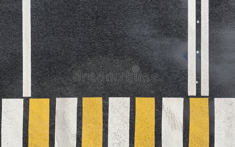 Zebra crosswalk on a asphalt road background