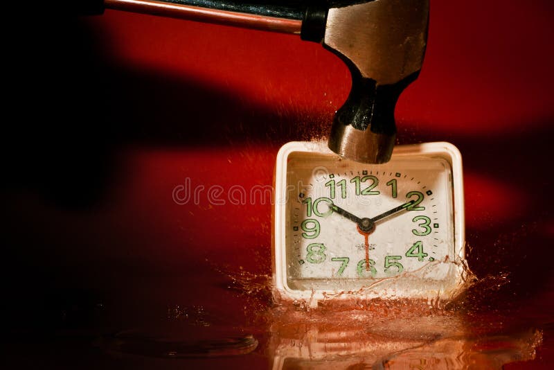 Breaking a clock with a hammer. Breaking a clock with a hammer