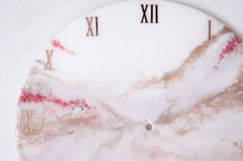 Handmade interior clocks made of epoxy resin. An interior item. Handmade interior clocks made of epoxy resin. An interior item