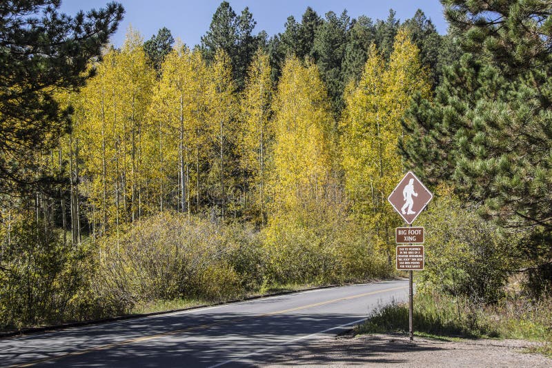 Sign posted on mountain road of Big Foot Xing for tourist safety. Sign posted on mountain road of Big Foot Xing for tourist safety.