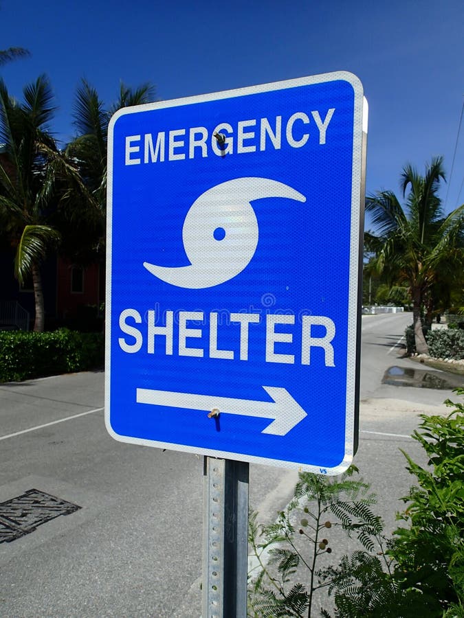 A sign showing the way to the emergency shelter for hurricanes in the Caribbean. A sign showing the way to the emergency shelter for hurricanes in the Caribbean