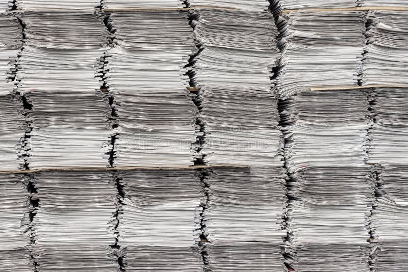 Horizontal shot of multiple stacks of newspapers as background. Horizontal shot of multiple stacks of newspapers as background.