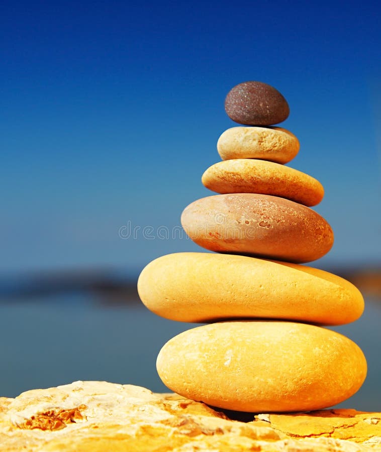 Concept of harmony and balance. Balance stones against the sea. Stock Photo