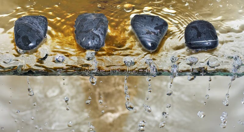 Zen stone pebble water drops