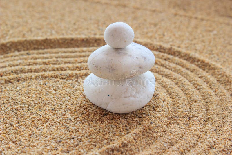 Zen stone on raked sand