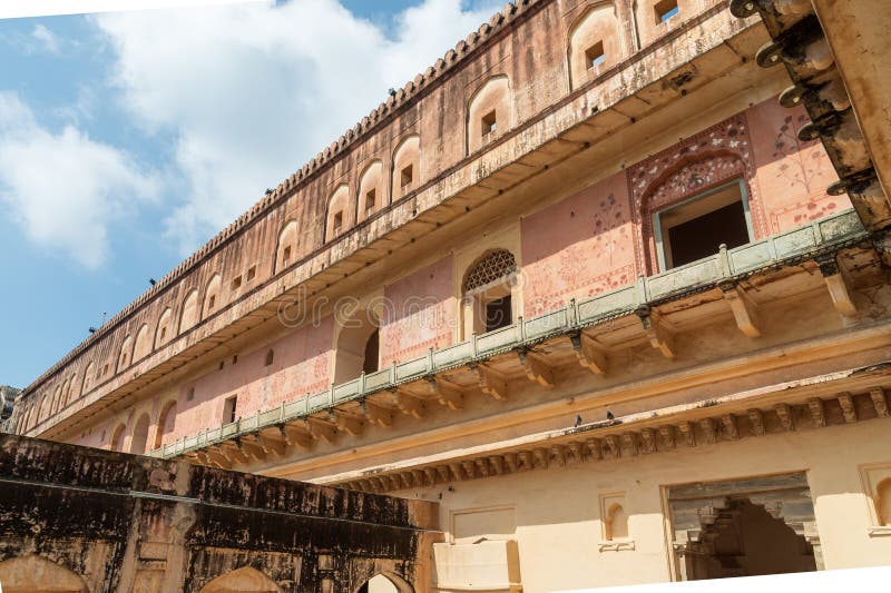 Zenani Deorhi in the Amber, Fort Amer , Rajasthan, India. Ornate gateway to the vast Amber Palace complex, with a painting of the Hindu elephant deity Ganesh.A narrow 4WD road leads up to the entrance gate, known as the Suraj Pol (Sun Gate) of the fort. It is now considered much more ethical for tourists to take jeep rides up to the fort, instead of riding the elephants. Amer Fort or Amber Fort is a fort located in Amer, Rajasthan, India. Amer is a town with an area of 4 square kilometres (1.5 sq mi) located 11 kilometres (6.8 mi) from Jaipur, the capital of Rajasthan. Located high on a hill, it is the principal tourist attraction in Jaipur. Amer Fort is known for its artistic style elements. With its large ramparts and series of gates and cobbled paths, the fort overlooks Maota Lake which is the main source of water for the Amer Palace. Zenani Deorhi in the Amber, Fort Amer , Rajasthan, India. Ornate gateway to the vast Amber Palace complex, with a painting of the Hindu elephant deity Ganesh.A narrow 4WD road leads up to the entrance gate, known as the Suraj Pol (Sun Gate) of the fort. It is now considered much more ethical for tourists to take jeep rides up to the fort, instead of riding the elephants. Amer Fort or Amber Fort is a fort located in Amer, Rajasthan, India. Amer is a town with an area of 4 square kilometres (1.5 sq mi) located 11 kilometres (6.8 mi) from Jaipur, the capital of Rajasthan. Located high on a hill, it is the principal tourist attraction in Jaipur. Amer Fort is known for its artistic style elements. With its large ramparts and series of gates and cobbled paths, the fort overlooks Maota Lake which is the main source of water for the Amer Palace.