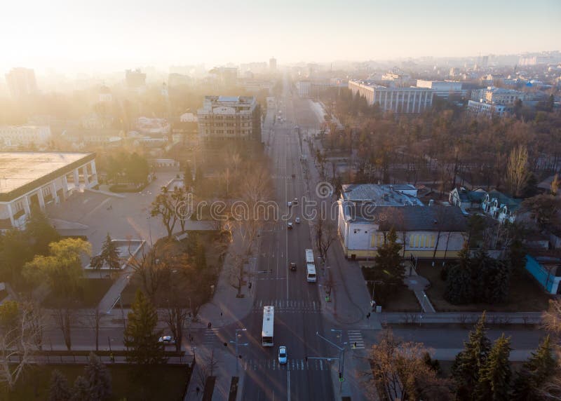Aerial drone view of Stefan cel mare central boulevard at sunrise in Chisinau with cars, Moldova. Aerial drone view of Stefan cel mare central boulevard at sunrise in Chisinau with cars, Moldova