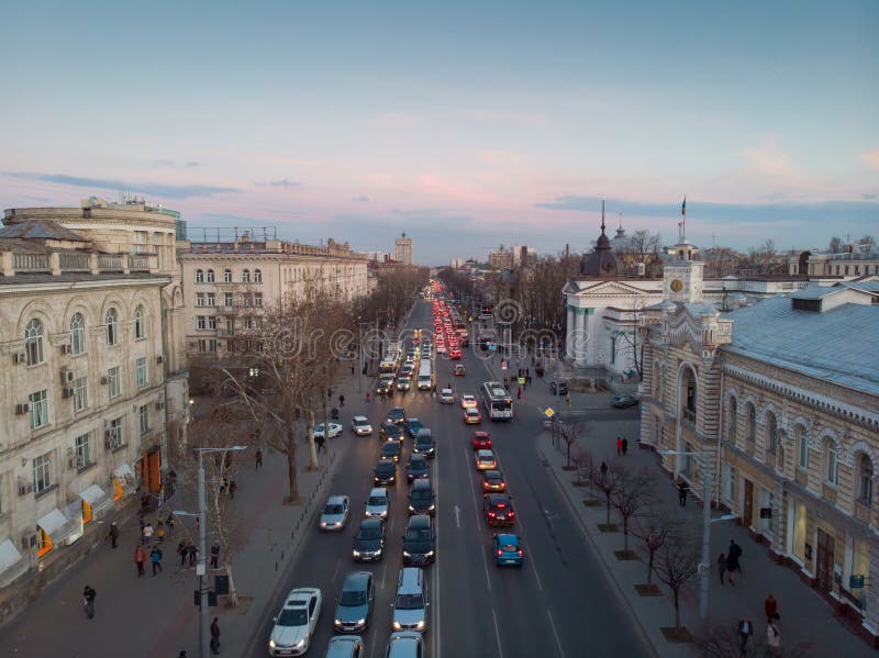 Stefan cel mare central boulevard at sunset in Chisinau with cars, Moldova. Stefan cel mare central boulevard at sunset in Chisinau with cars, Moldova