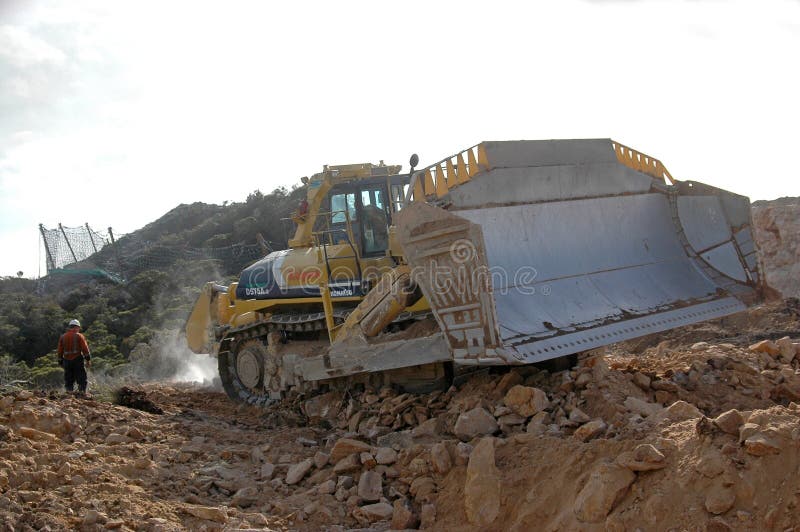 World's biggest bulldozer ripping overburden at Stockton Coal Mine, West Coast, South Island, New Zealand. World's biggest bulldozer ripping overburden at Stockton Coal Mine, West Coast, South Island, New Zealand