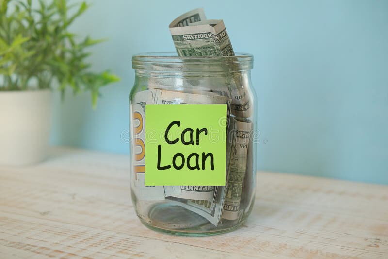 puts 100 dollars in a glass jar with the text car. Concept of saving money. puts 100 dollars in a glass jar with the text car. Concept of saving money